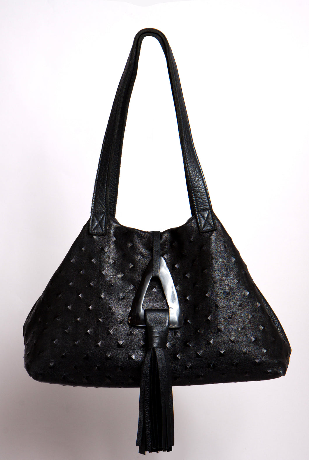 <b>Stacie</b><br> <p><font size=“3px”> Black Pyramid Tote With Horn Tassel</font></p>