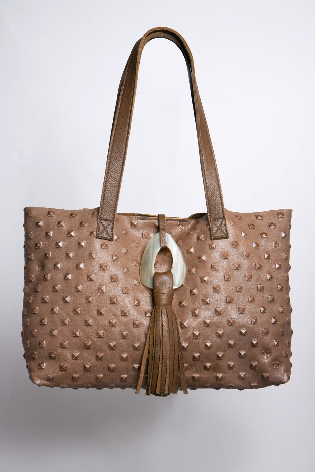 <b>Stacie</b><br> <p><font size=“3px”> Taupe Pyramid Tote With Horn Tassel</font></p>