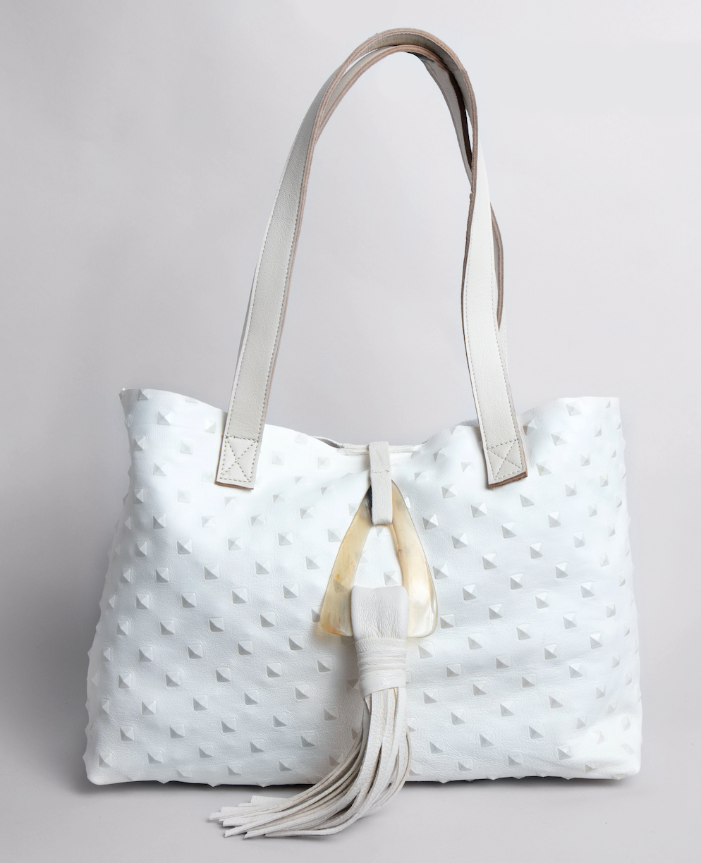 <b>Stacie</b><br> <p><font size=“3px”> White Pyramid Tote With Horn Tassel</font></p>